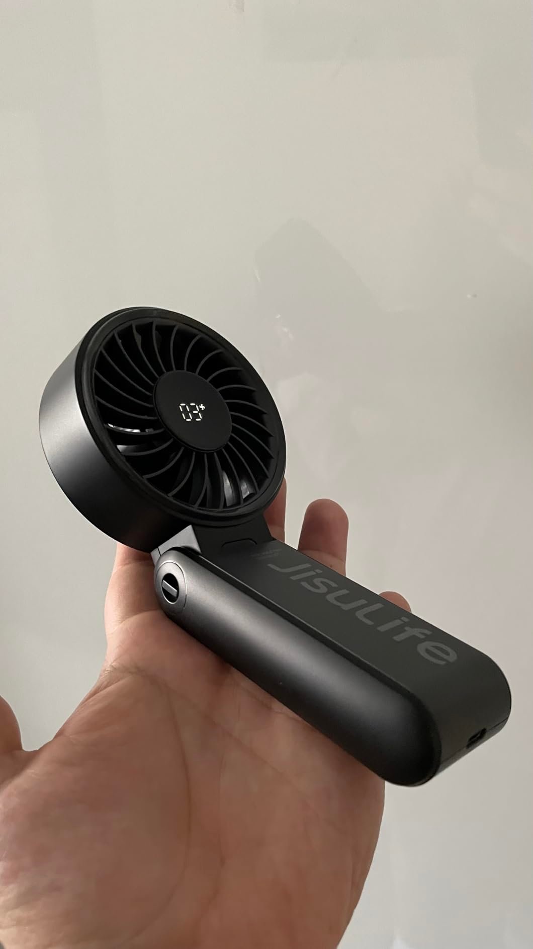 JISULIFE Handheld Fan Life7 – Ultimate Flexibility: High-Power Motor. LED Display. 19.5 Hrs Cooling. 5000mAh Rechargeable. 5-Speed. Foldable Design. 3-IN-1 Portable Fan for Travel Cruise Beach(Grey) photo review