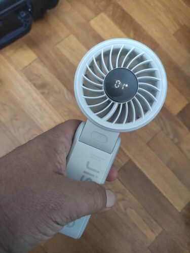 JISULIFE Handheld Fan Life7 – Ultimate Flexibility: High-Power Motor. LED Display. 19.5 Hrs Cooling. 5000mAh Rechargeable. 5-Speed. Foldable Design. 3-IN-1 Portable Fan for Travel Cruise Beach(Grey) photo review
