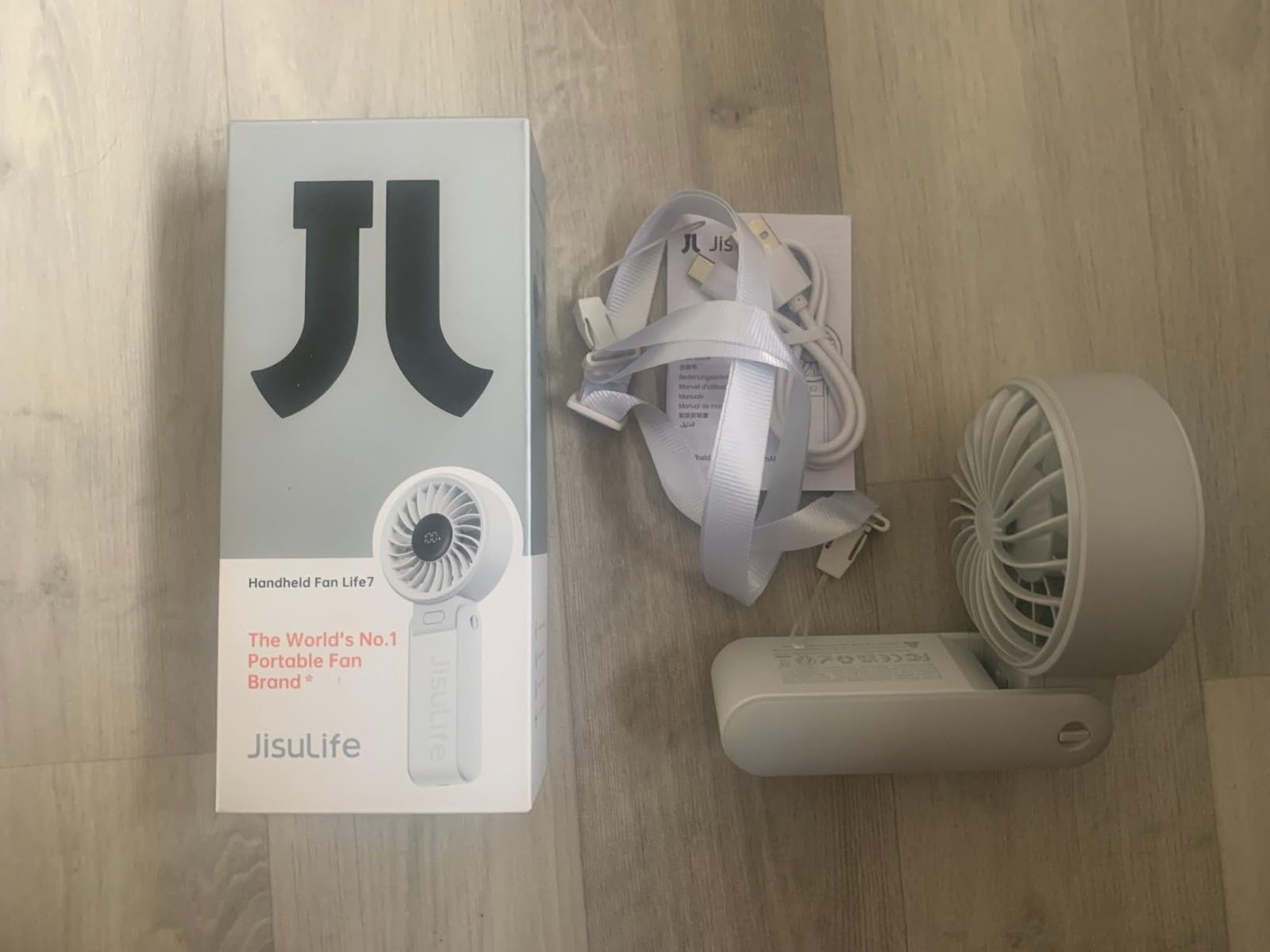 JISULIFE Handheld Fan Life7 – Ultimate Flexibility: High-Power Motor. LED Display. 19.5 Hrs Cooling. 5000mAh Rechargeable. 5-Speed. Foldable Design. 3-IN-1 Portable Fan for Travel Cruise Beach(Grey) photo review