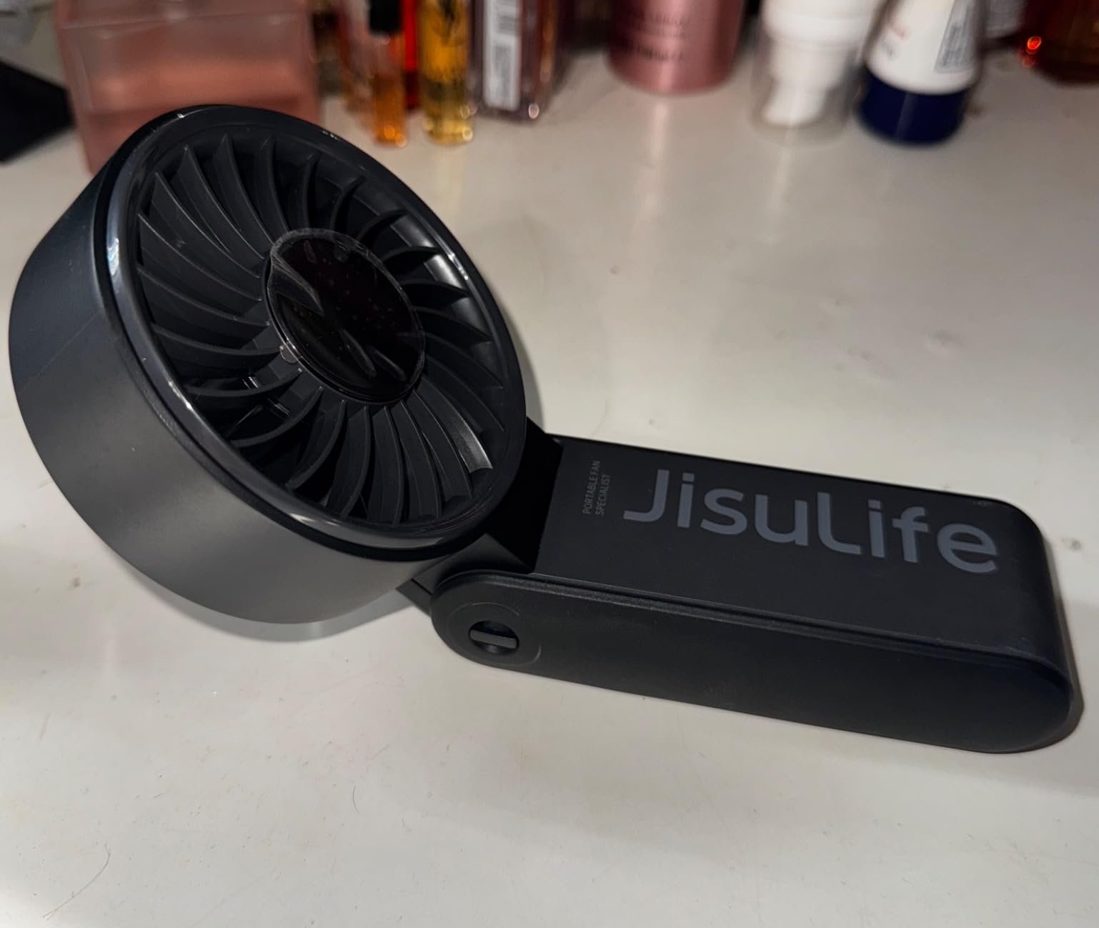 JISULIFE Handheld Fan Life7 – Ultimate Flexibility: High-Power Motor. LED Display. 19.5 Hrs Cooling. 5000mAh Rechargeable. 5-Speed. Foldable Design. 3-IN-1 Portable Fan for Travel Cruise Beach(Grey) photo review