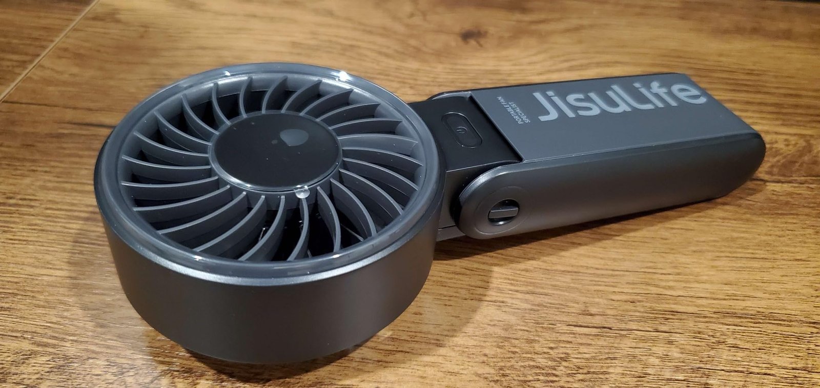 JISULIFE Handheld Fan Life7 – Ultimate Flexibility: High-Power Motor. LED Display. 19.5 Hrs Cooling. 5000mAh Rechargeable. 5-Speed. Foldable Design. 3-IN-1 Portable Fan for Travel Cruise Beach(Grey) photo review