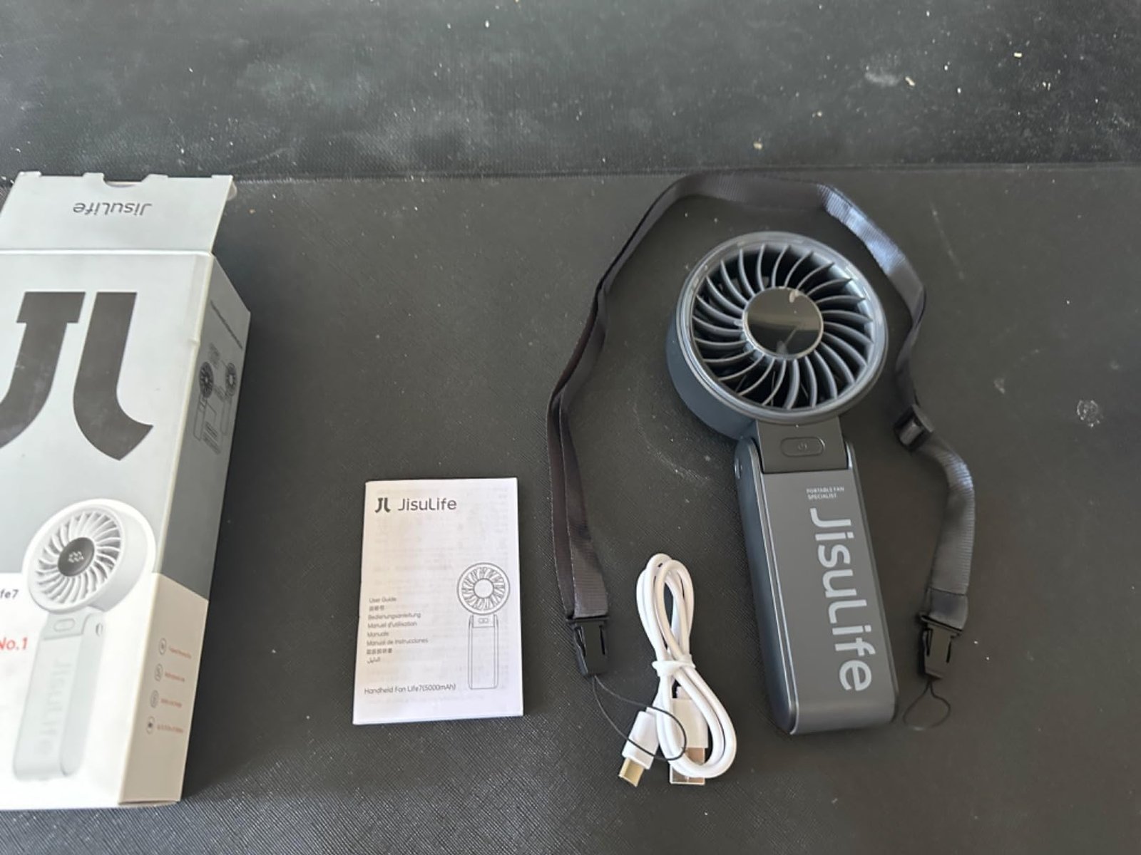 JISULIFE Handheld Fan Life7 – Ultimate Flexibility: High-Power Motor. LED Display. 19.5 Hrs Cooling. 5000mAh Rechargeable. 5-Speed. Foldable Design. 3-IN-1 Portable Fan for Travel Cruise Beach(Grey) photo review