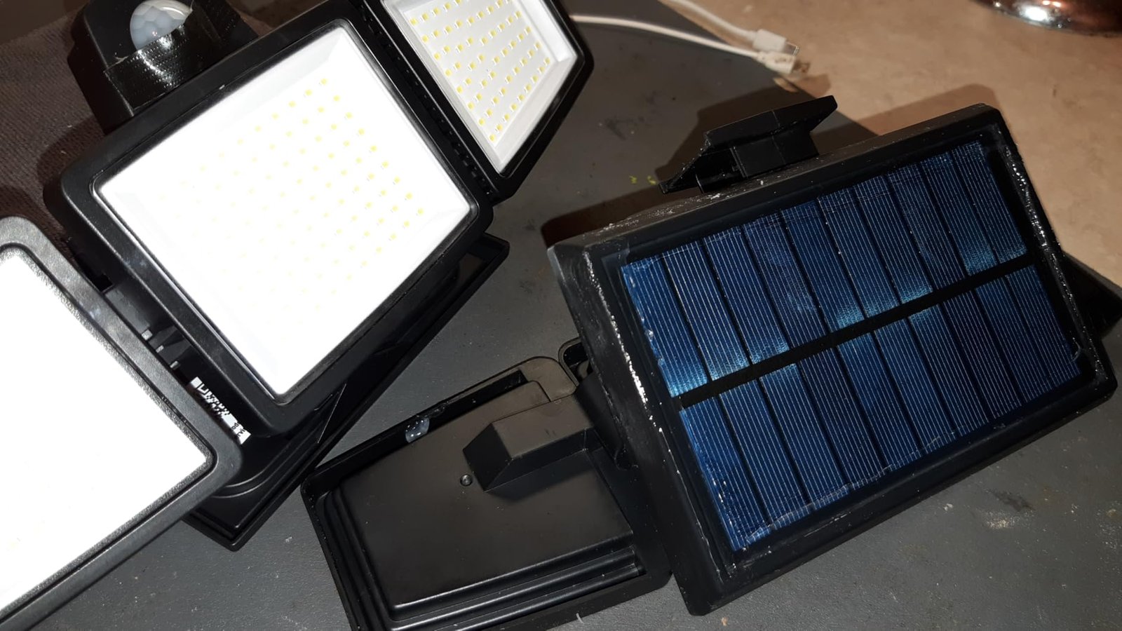 Tuffenough Solar Outdoor Lights 2500LM 210 LED Security Lights with Remote Control.3 Heads Motion Sensor Lights. IP65 Waterproof.270° Wide Angle Flood Wall Lights with 3 Modes(2 Packs) photo review